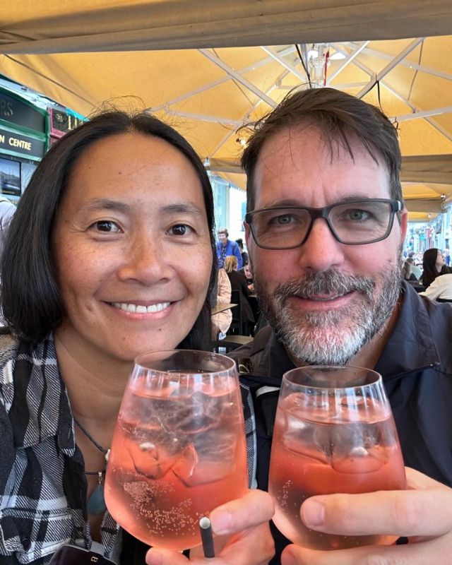 Dog and Dragon selfie holding bajtra spritz for a cheers.