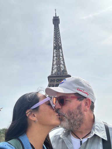 Dog and Dragon kiss in front of the Eiffel Tower.