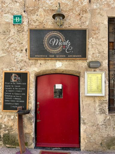 Photo of the front door and signage for Moritz & Srta C in Mahon, Menorca